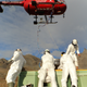 Mission staff loading bait into helicopter buckets on South Georgia Island in the southern Atlantic.